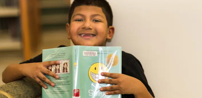 Small Boy Reading a Children's Book at Suffern Free Library