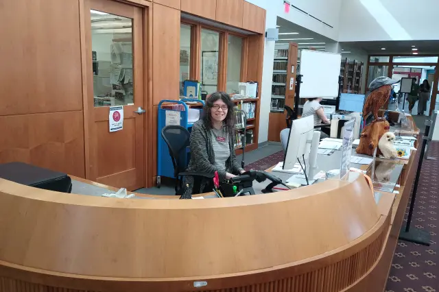 Melissa, a Librarian at Suffern Free Library, Sits at the Reference Desk